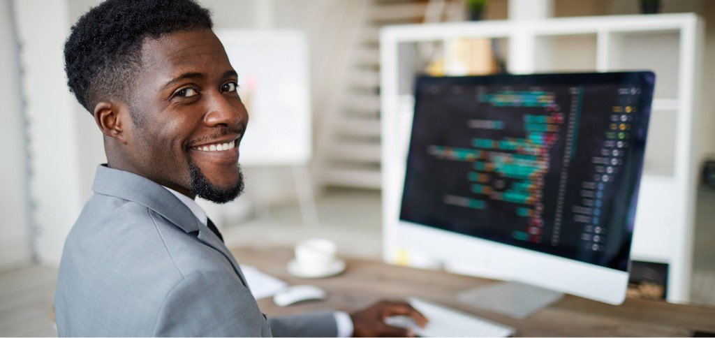 IT specialist working at desktop computer